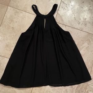 Black flowy top with key hole neckline and halter look from Anthropologie
